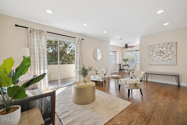 living room with recessed lighting, baseboards, and wood finished floors