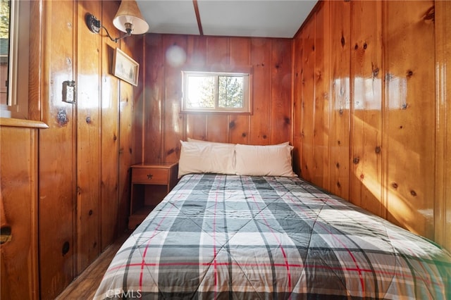 unfurnished bedroom with wood walls