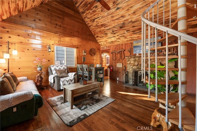 living room featuring high vaulted ceiling, wooden ceiling, wood walls, and wood finished floors