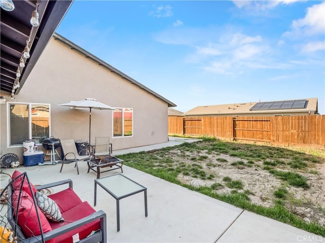 view of patio featuring fence