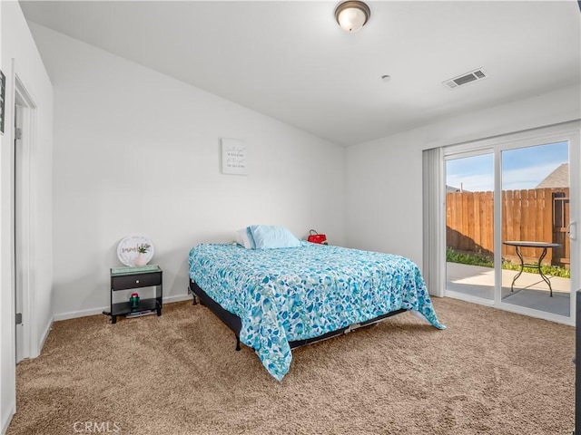 carpeted bedroom with lofted ceiling, access to outside, visible vents, and baseboards