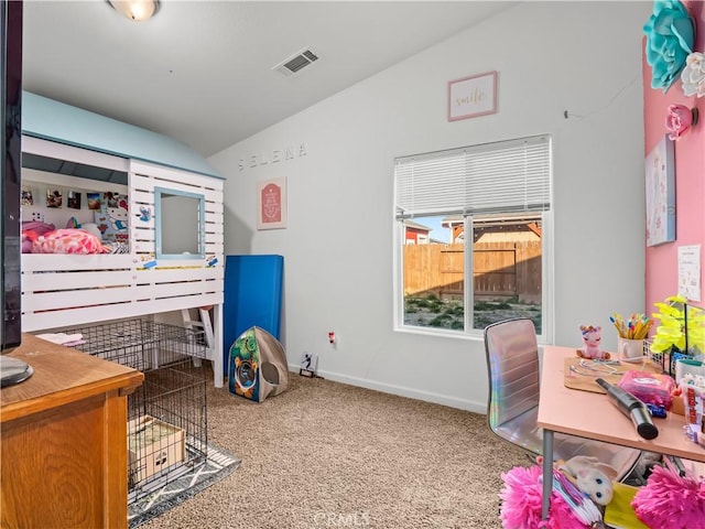 carpeted bedroom with baseboards, visible vents, and vaulted ceiling