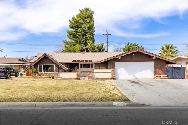 view of front facade with an attached garage, fence, concrete driveway, and a front yard