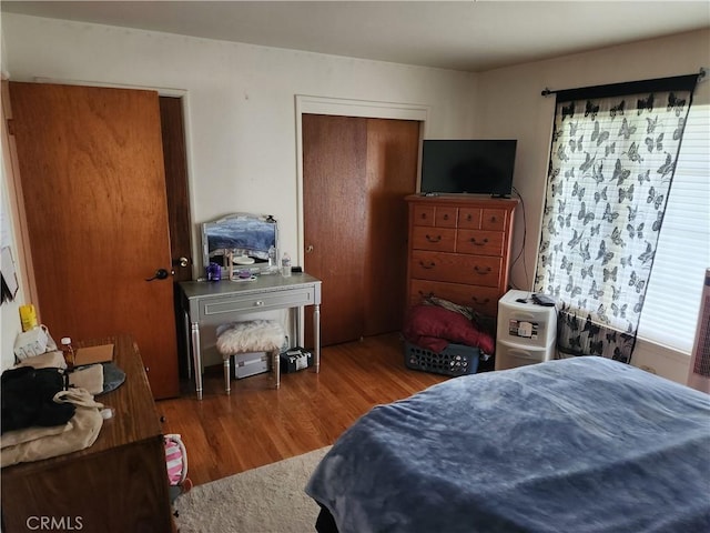 bedroom with wood finished floors