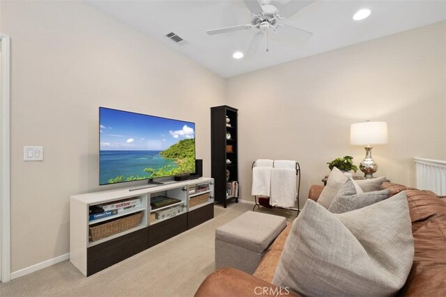 living room featuring recessed lighting, light colored carpet, a ceiling fan, baseboards, and visible vents