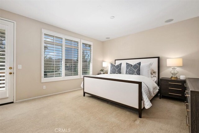 bedroom with carpet and baseboards