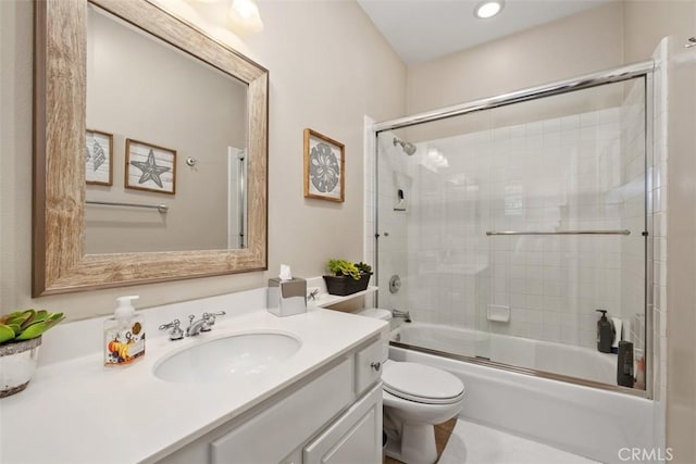 bathroom featuring shower / bath combination with glass door, vanity, and toilet