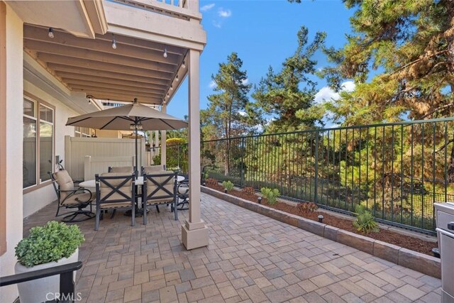 view of patio featuring a fenced backyard and outdoor dining area