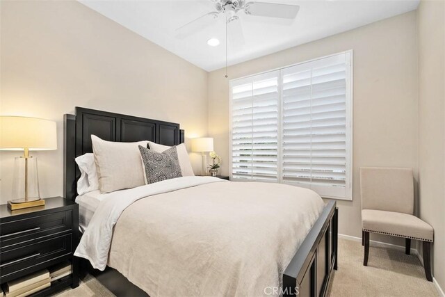 bedroom with a ceiling fan, recessed lighting, light carpet, and baseboards