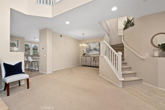 interior space featuring an inviting chandelier, visible vents, baseboards, and recessed lighting