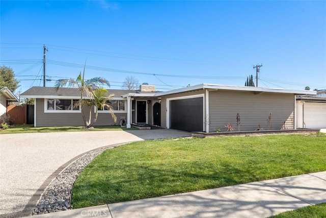 single story home with aphalt driveway, a front yard, fence, and an attached garage