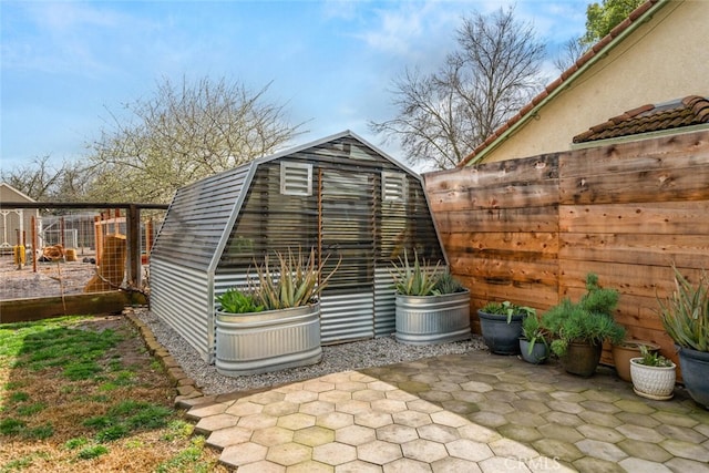 view of outdoor structure with an outdoor structure and fence