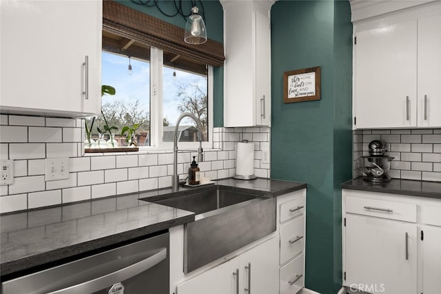 kitchen featuring dishwasher, backsplash, white cabinetry, and a sink