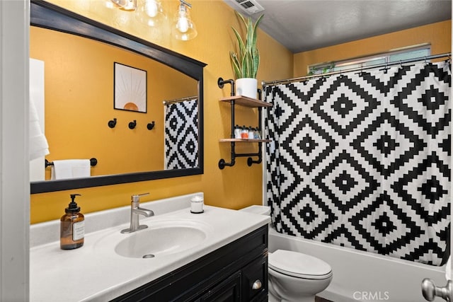 bathroom with visible vents, toilet, and vanity