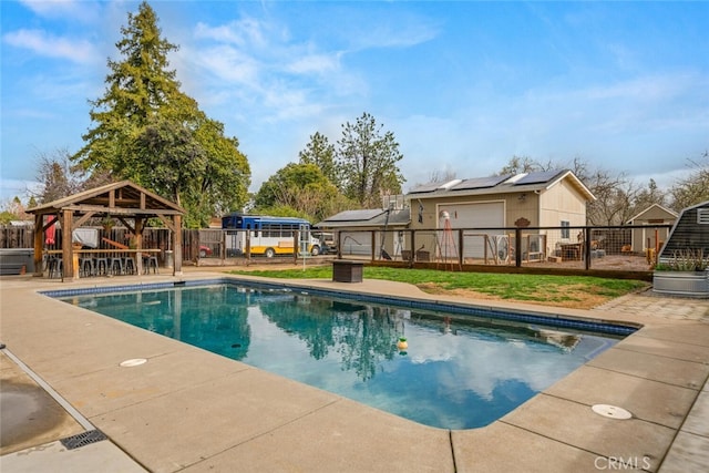 view of pool featuring a gazebo, a patio, a yard, and fence