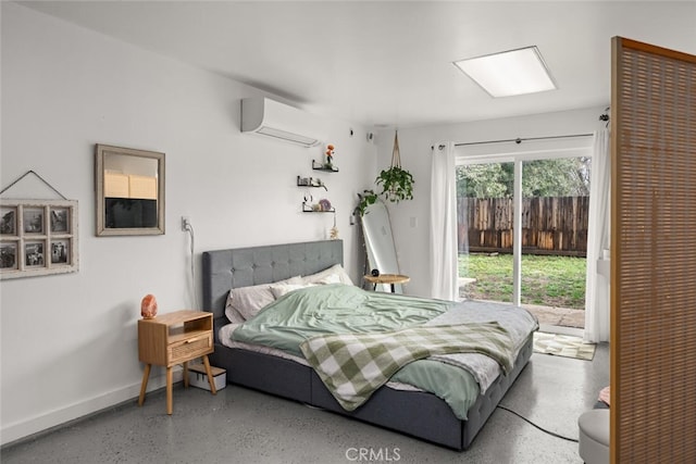 bedroom featuring access to exterior, an AC wall unit, speckled floor, and baseboards