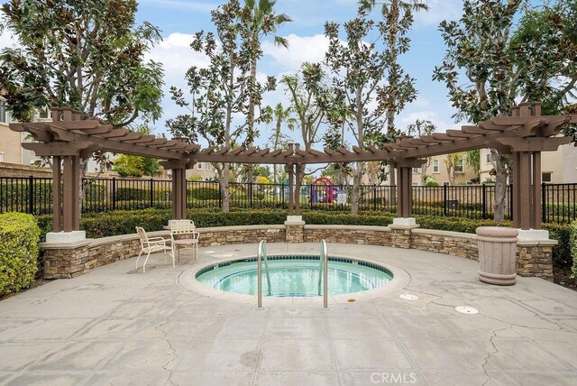 view of pool featuring a patio area, fence, a community hot tub, and a pergola