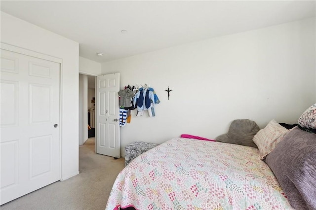 bedroom featuring light colored carpet