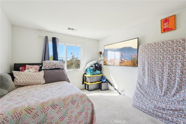 bedroom featuring carpet flooring and visible vents