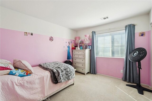 bedroom featuring visible vents and carpet floors