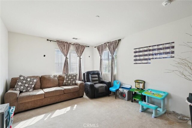 carpeted living room with visible vents