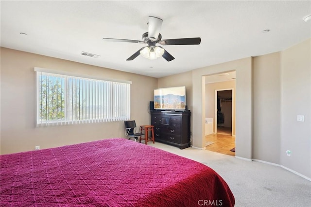 bedroom featuring carpet flooring, ceiling fan, visible vents, and baseboards