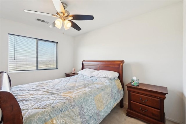 carpeted bedroom with visible vents and ceiling fan