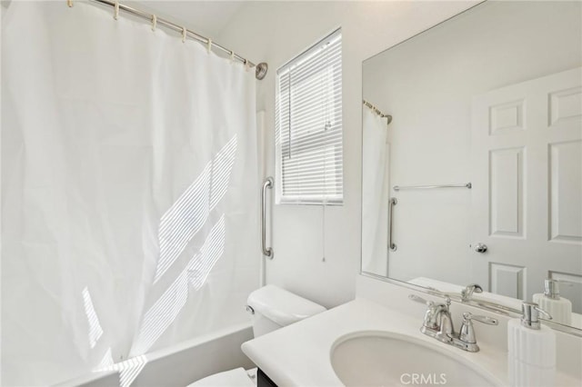 full bathroom featuring shower / bath combination with curtain, toilet, and vanity