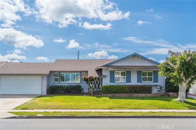 ranch-style home featuring driveway, stucco siding, a garage, and a front yard