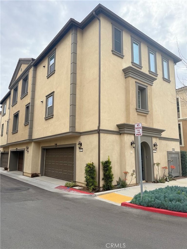 view of building exterior featuring a garage