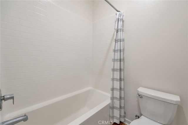 full bathroom with toilet and shower / bath combo