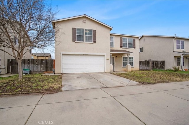 traditional home featuring stucco siding, driveway, a garage, and fence