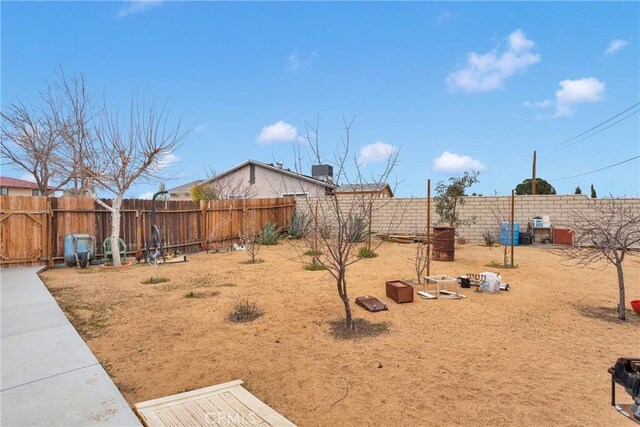 view of yard with a fenced backyard