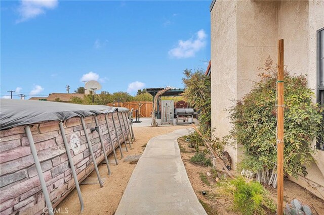 surrounding community featuring a patio area and fence