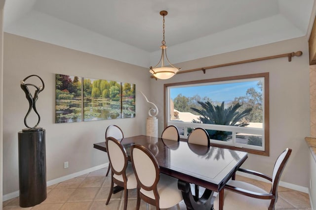 dining room with light tile patterned floors and baseboards