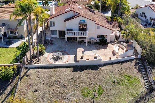 back of property with a patio area, a fenced backyard, outdoor dining space, and stucco siding