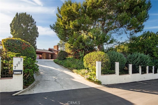 obstructed view of property with fence