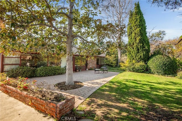 view of yard featuring a patio area and fence