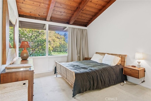 carpeted bedroom with lofted ceiling with beams and wood ceiling