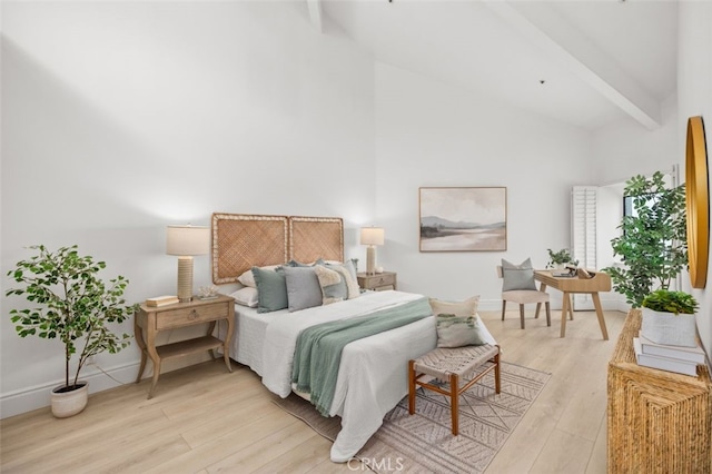 bedroom with baseboards, high vaulted ceiling, beamed ceiling, and light wood-style floors