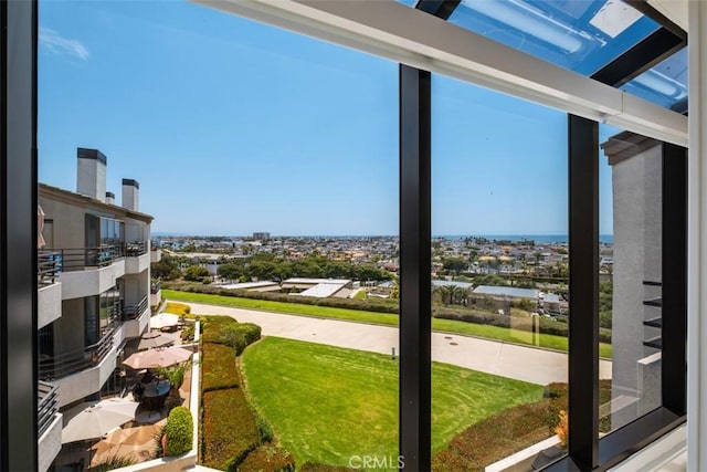 exterior space featuring a wealth of natural light, a city view, and a water view