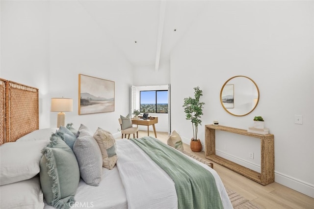 bedroom with light wood-style floors, baseboards, high vaulted ceiling, and beam ceiling