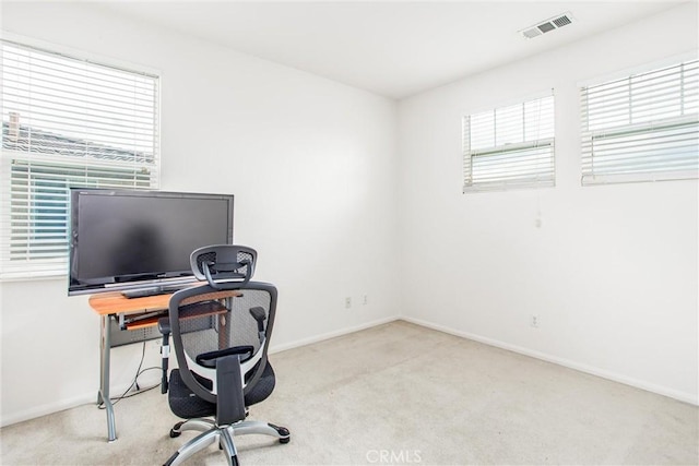 office with carpet floors, baseboards, and visible vents