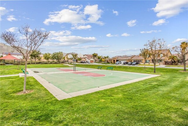 view of sport court with a yard, a residential view, and community basketball court