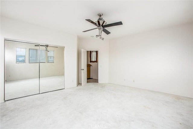 unfurnished bedroom featuring a ceiling fan, a closet, and concrete floors