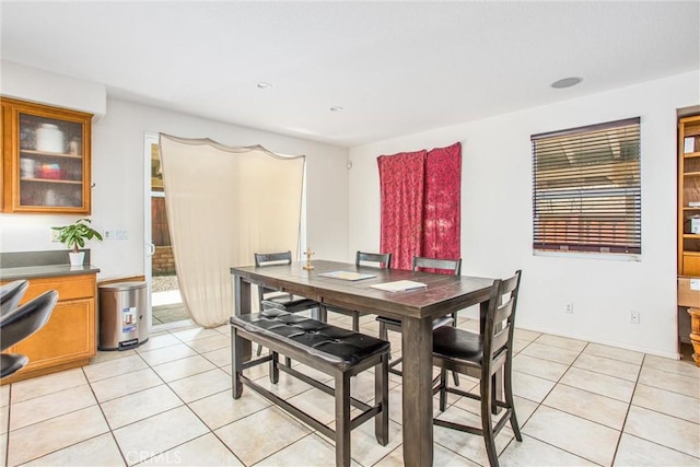 dining room with light tile patterned flooring