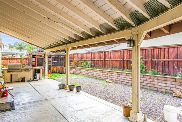 view of patio / terrace featuring a fenced backyard and grilling area