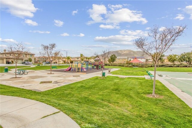 community play area featuring a lawn