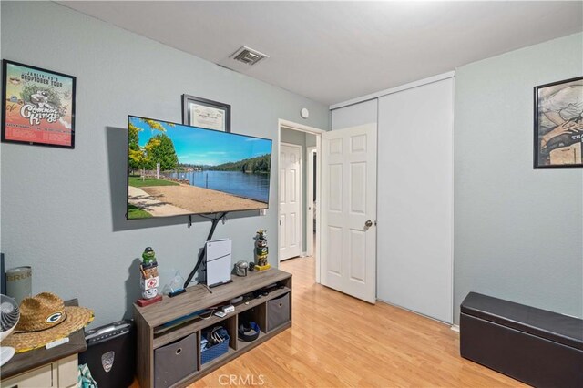 office area with visible vents and wood finished floors