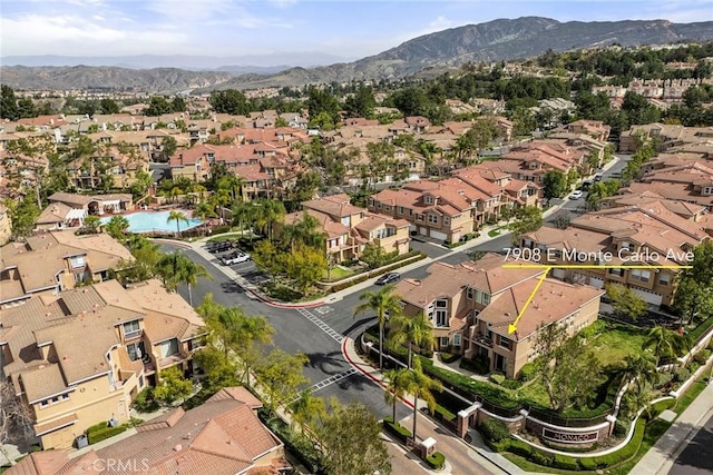 birds eye view of property with a residential view and a mountain view